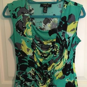 Sleeveless colorful top with ruching details.